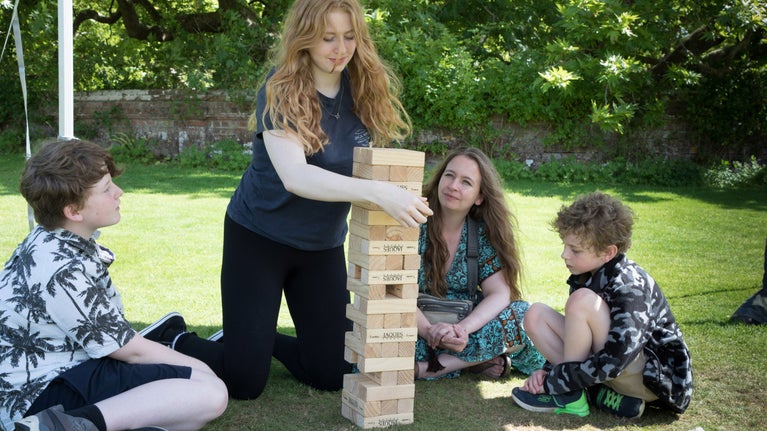 A family play giant Jenga in the garden at Blickling Estate